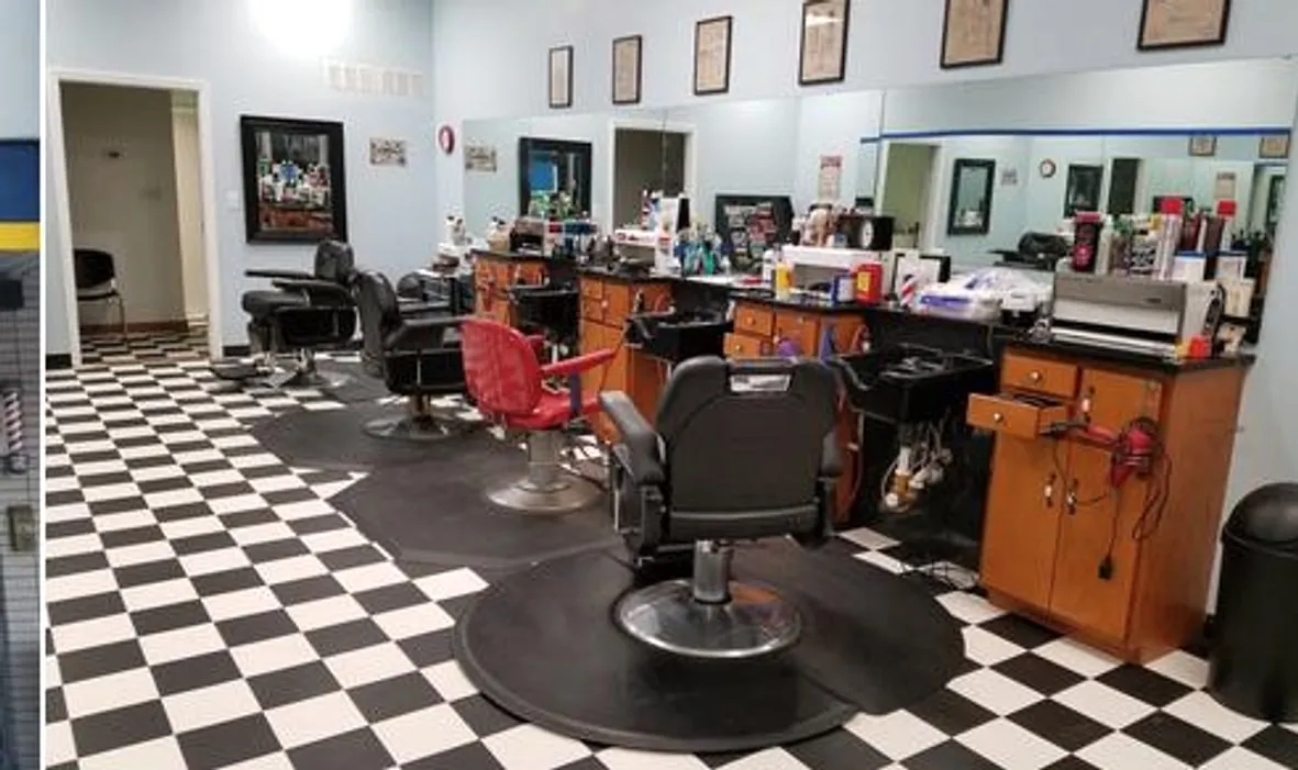 Inside Red Bank Barber Shop with its checkerboard floor and barber chairs